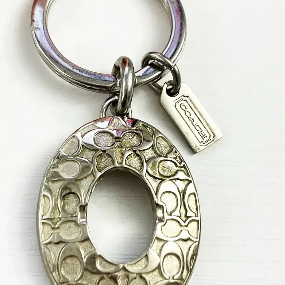 Coach Silver Tone Oval Signature C Keychain